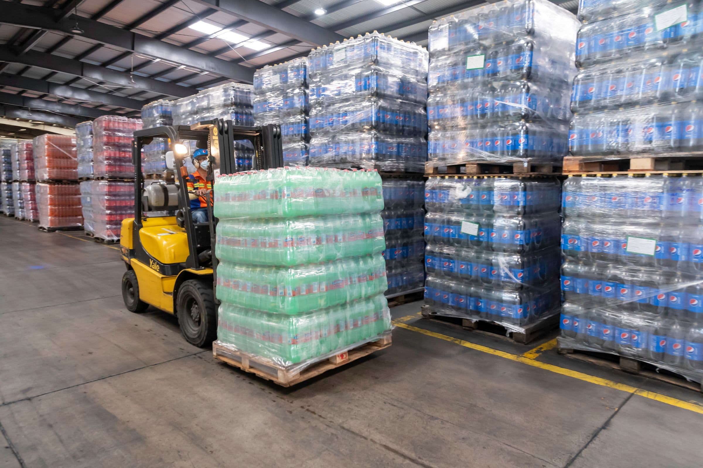 Pallets stacked in a warehouse aisle